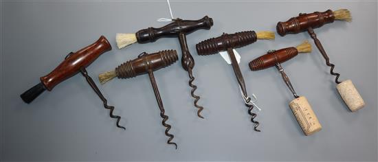 Six 19th century English steel and wood handled corkscrews,